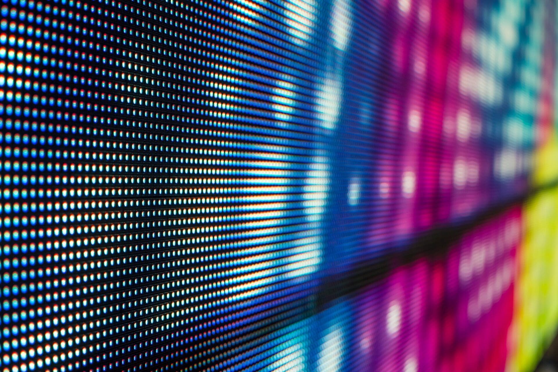 An electronic display screen that has colorful screens, in the style of macro perspectives, net art, selective focus, subdued pointillism, mood lighting, creative commons attribution, light violet and blue